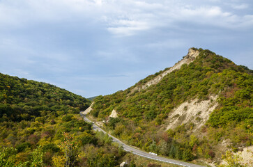 Autumn View to road to Gombori pass and Caucasian mountains covered forest from Medieval Ujarma...