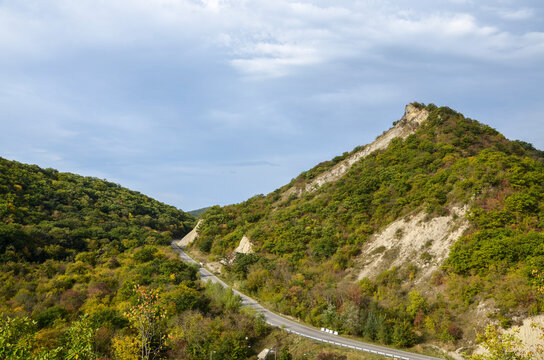 Autumn View to road to Gombori pass and Caucasian mountains covered forest from Medieval Ujarma fortress in Kakheti region of Georgia