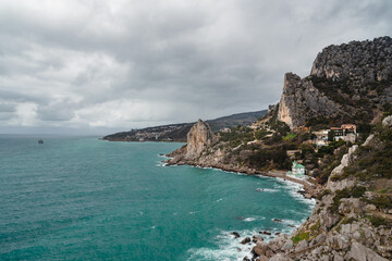 Coastal seascape landscape with Mount Cat or Koshka from rock Diva on cloudy weather. Simeiz, Crimea