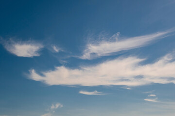 blue sky panorama may use for sky replacement. blue sky background with white striped clouds in heaven and infinity.