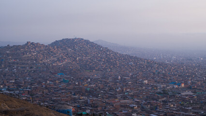 Cityscape of poorer neighbourhood on hill in Lima, Peru.