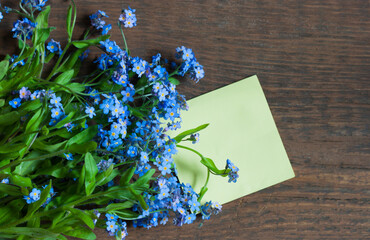 Blue flowers on a wooden background