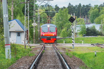 Local passenger train approaches to the station.