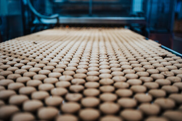 Huge factory line for sweet food and cookies production. Close up shots of industrial manufacturing...