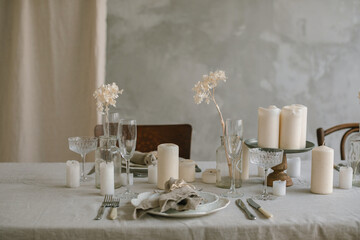 Aesthetics table setting in beige colors. Natural materials, home decorations.
