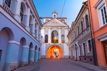 Fototapeta na wymiar Picturesque Street and Gate of Dawn Old Town of Vilnius, Lithuania, Baltic states. The inscription in Latin: Mother of mercy under your protection