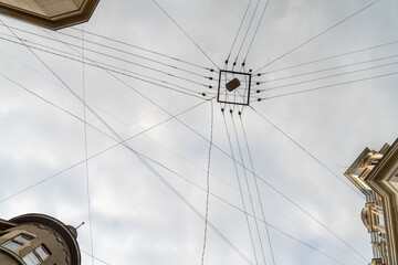 Fototapeta premium Cityscape of old town street with lot of wires