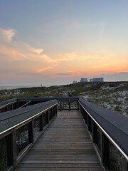 wooden walkway at sunset on Florida beach 