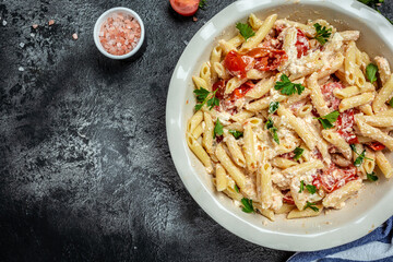 Trend Feta pasta recipe made of cherry tomatoes, feta cheese, garlic and herbs. cooking recipe ingredients, place for text, top view