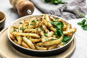Healthy Homemade food, roasted parsnips side dish on plate. Delicious vegetarian breakfast or snack, Clean eating, dieting, vegan food concept. top view