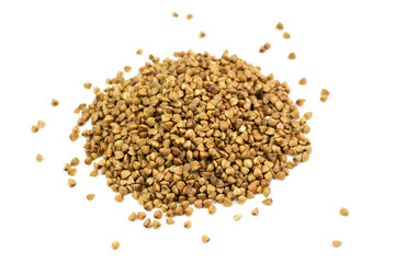 Brown buckwheat groats close-up on a white isolated background (isolate). Side view.