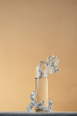 vertical shot, glass vase with flowers on the table, pastel colors