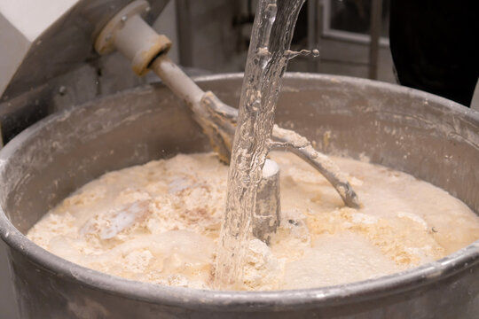 Close Up Of A Baker Kneading Bread Dough In A Metal Mixing Bowl High-Res  Stock Photo - Getty Images