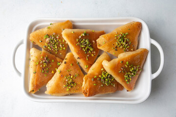 Traditional Turkish desserts; custard triangular dessert, albanian dessert ( Turkish name; Arnavut tatlisi or muhallebili muska tatlisi)