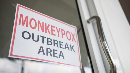 Monkeypox outbreak concept. text message paper Attached behind glass, notice, do not enter the...
