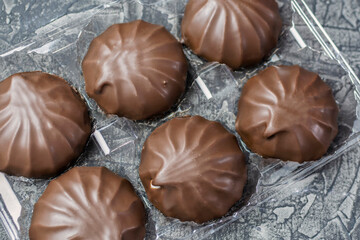 Beautiful marshmallow in chocolate glaze close-up.