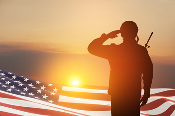 USA army soldier saluting with nation flag on a background of sunset or sunrise. Greeting card for...