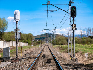 High luminous railway signals located in the middle of the track and their corresponding ASFA beacons
