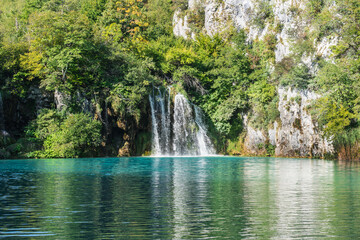 Fototapeta na wymiar Plitvice Lakes in Croatia with beautiful waterfall and blue water