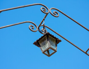Hanging garden lantern over deep blue sky