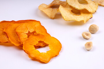 Dried apples and persimmons on a white background