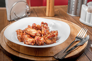 fried chicken legs on a wooden table