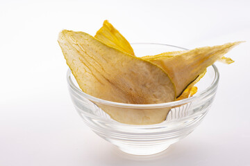 Dried pear in a plate on a white background