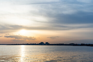 View of the reflection in the Black Sea against the background of the sky and sunset