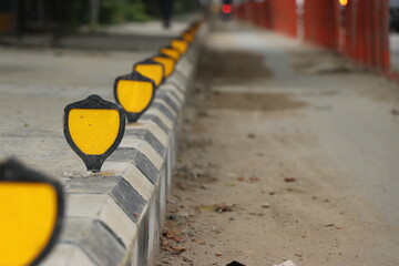 Reflectors beside road are used to provide safety for vehicle riders during night