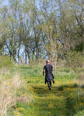 Photographer in a field in springtime in rural Ontario