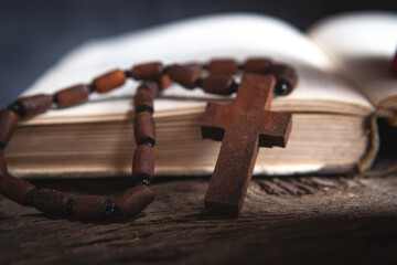 wooden cross on the book