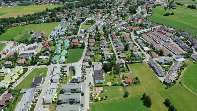 Beautiful mountain view in the city of Lienz, Austria. Alpine mountains, clouds and sunlight over the city. Aerial view over the Austrian city in the mountains Alps	
