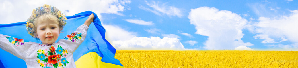 Patriotic Girl Flying Ukrainian Flag, Ukraine August 24 banner. Kid standing outdoors at sunset. International day of democracy concept. Flag Day. Constitution day. Copy space.