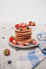 Pancakes with strawberries, blueberries