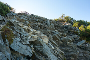 Fototapeta na wymiar Rocky mountain hillside with big stone boulders on sunny day
