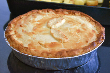 Chicken pot pie in aluminium foil pan.