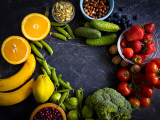 Different vegetables and fruits on an old background
