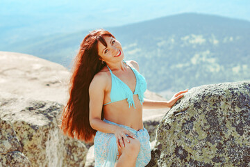 beautiful girl in a swimsuit in the mountains