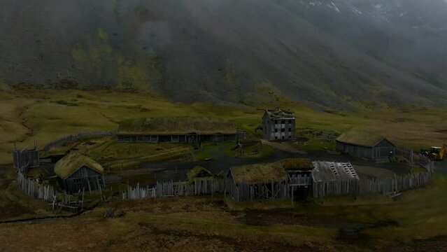 Aerial view of a viking village on a stormy rainy day near Stokksnes under Vestrahorn mountain, Iceland.
