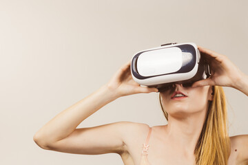 Girl wearing virtual reality goggles.