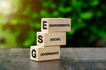 words ESG on a wood block and Future environmental conservation and sustainable ESG modernization...