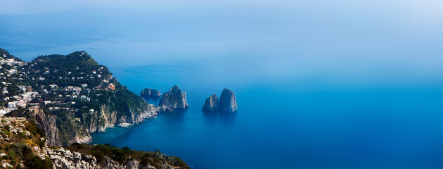 Scenic view of Capri Italy island coastal shoreline with copy space in tropical blue mediterranean sea