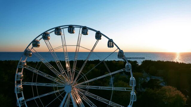 Sunset, pear and the ferries wheel in Palanga 