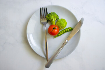 Vegetables on a plate, broccoli, cabbage, tomato