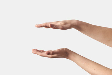 Two female open hands gesturing on white.