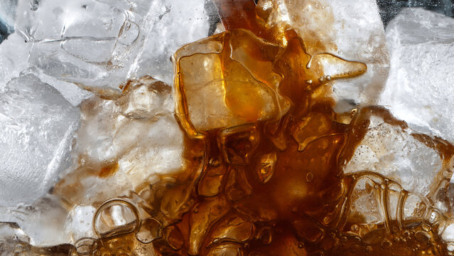 Super Slow Motion Shot of Pouring Coffee into Glass with Ice Cubes, Close-up