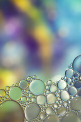 Fantasy colorful blurry background with ornament made of soft clear bubbles, abstract color splashes with copy space, focus on foreground