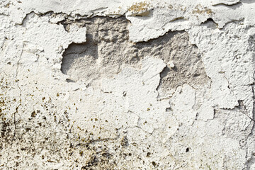 Old abstract wall background. Concrete painted surface with cracks, gouges and peeling paint. Grunge background texture