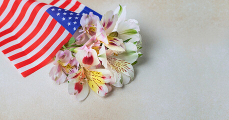 Creative American style background with lilac flowers and usa flag