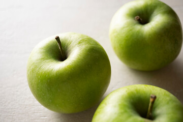 Green apples on the table, close up